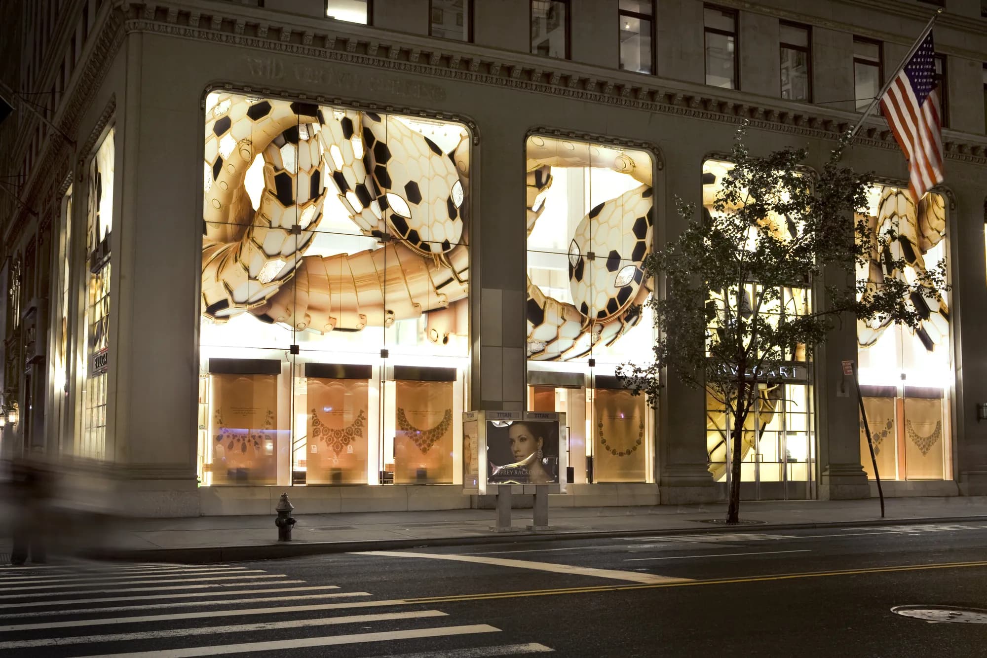 Bulgari facade at dusk with illuminated Serpenti window graphics