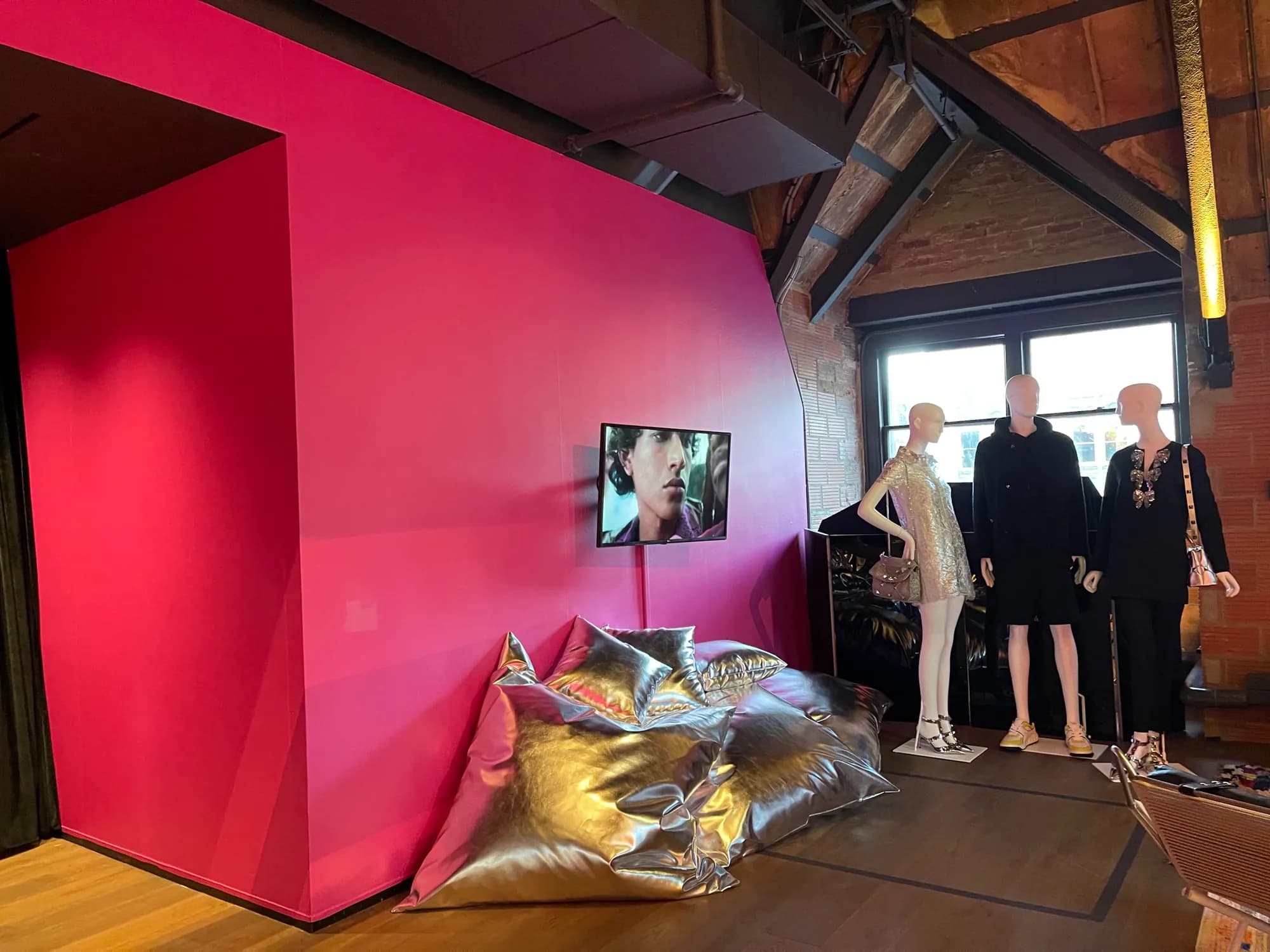 Valentino Party Collection at Fotografiska: hot-pink wall, silver floor cushions and mannequins