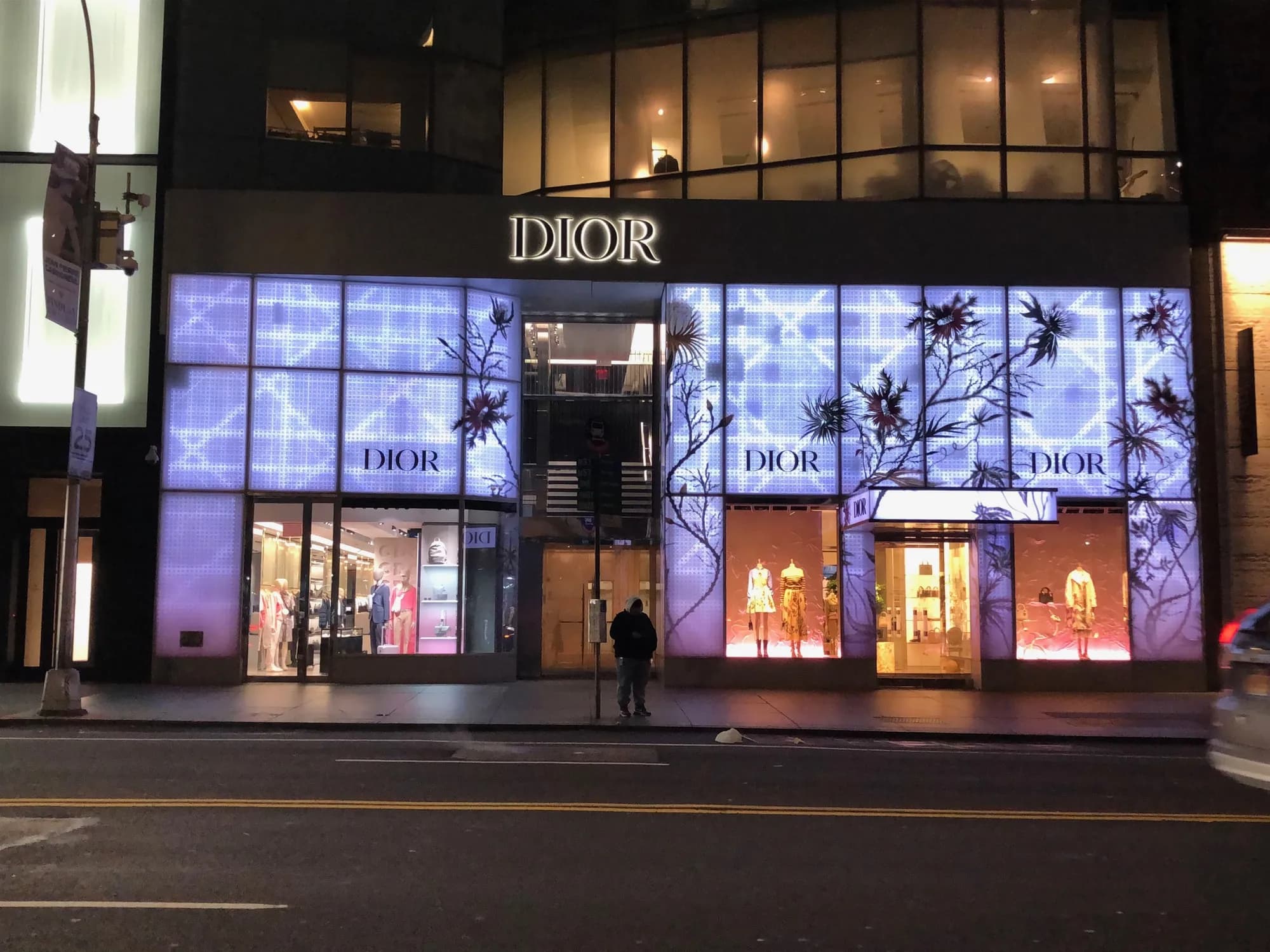 Wide night view of the Dior 57th Street facade with illuminated patterned panels
